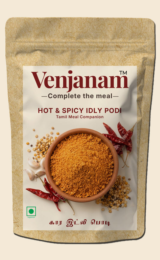 Venjanam hot & spicy idly podi packaging with a bowl of spice and red chilies on a beige background