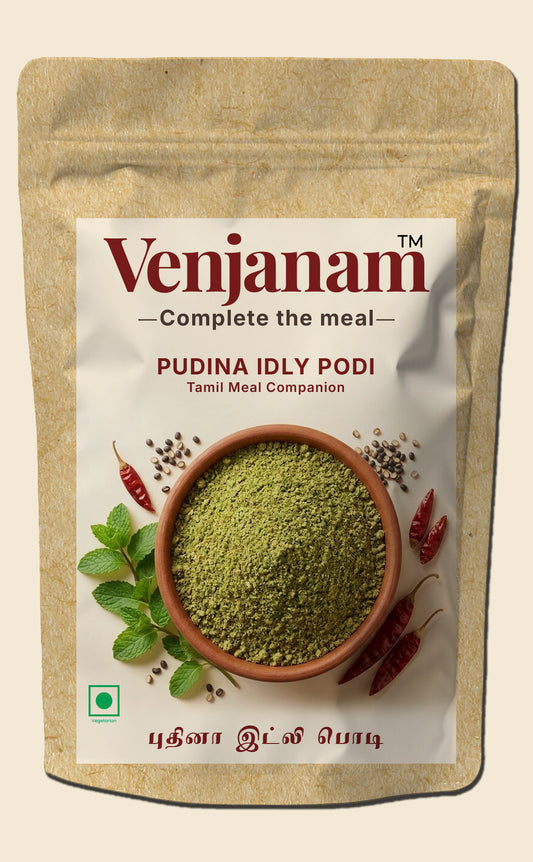 Venjanam Pudina Idly Podi packaging with green powder in a bowl on a beige background